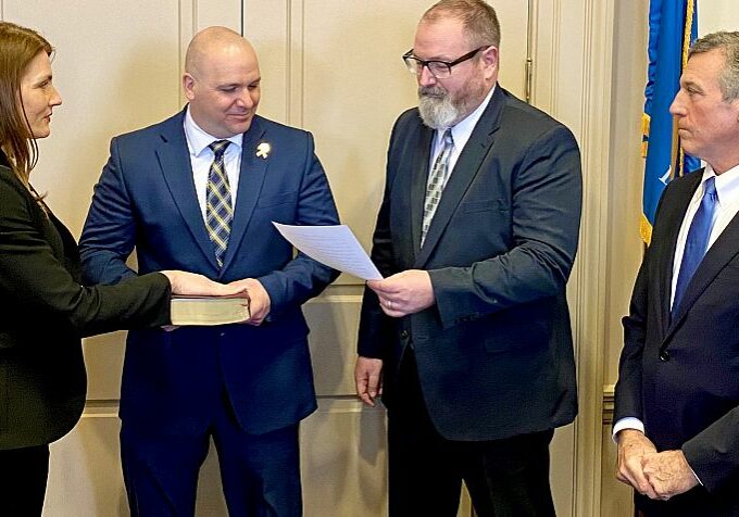 (L-R) Commissioner Terra Taylor, Department of Correction Deputy Commissioner Shane Troxler, Deputy Attorney General Michael Tipton (administering the Oath of Office), and Governor John Carney