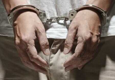 Arrested and Handcuffed - Photo: © Copyright bluehand/shutterstock