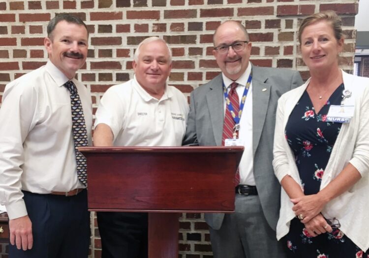 Robbie Murray, Sussex County, EMS Deputy Director Operations, Robert Stuart, Sussex County EMS Director, Rick Schaffner, Beebe Healthcare Interim CEO, Executive Vice President & COO, and Kim Blanch, Community Services Manager, Beebe Healthcare Population Health, pose for a photo after signing a memorandum of understanding between the two organizations that will bring more personalized care to the homes of COPD patients. (Beebe Healthcare)