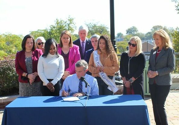 Gov. John Carney signed a tuition waiver program that helps foster children Thursday (photo courtesy of Gov. John Carney's office)