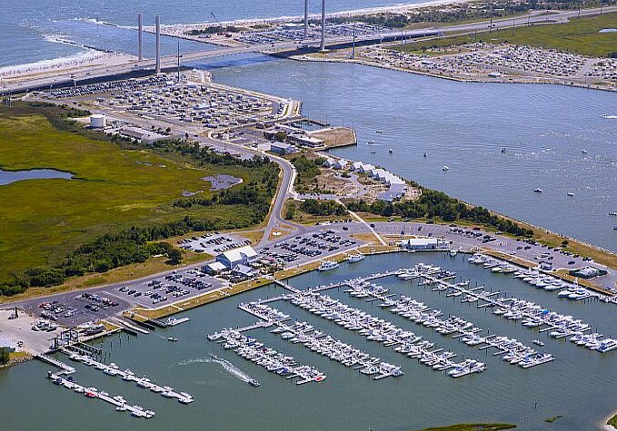 Indian River Marina, Delaware’s largest, is a destination for boaters seeking direct access to the rich Atlantic Ocean and inland bays fishing grounds. The marina has boat slips with a floating dock system and spots for indoor dry boat storage. A monitored public boat ramp with shuttle service to parking is available in the summer. It also serves as a waterfront event space with beautiful sunset views, offers full-service bait and tackle along with fish cleaning and an on-site fresh seafood market.