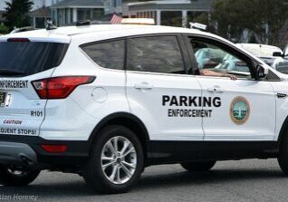 Rehoboth's new parking enforcement vehicle. R-101 is a leased Ford Escape SE that is outfitted with dual license plate recognition (LPR) cameras, GPS, wifi/cellular connectivity, plenty of computer technology and a distinctive emergency lighting package. Image courtesy WGMD/Alan Henney. 