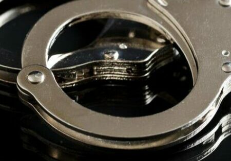 Silver handcuffs on black background
Image © Jiri Hera-shutterstock_335320826 