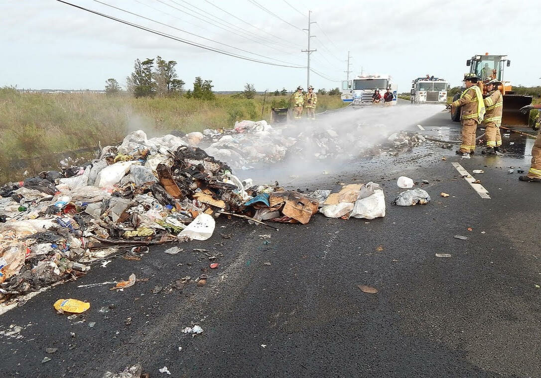 A garbage truck caught fire on Coastal Highway south of Dewey Beach Tuesday morning (photo: Chuck Snyder)