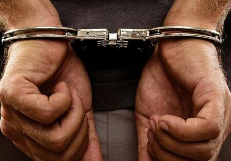 Close-up. Arrested man handcuffed - Photo: © Copyright Jinga/Shutterstock