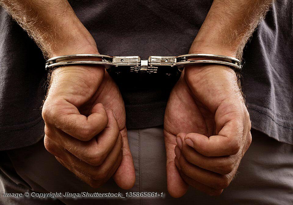 Close-up. Arrested man handcuffed - Photo: © Copyright Jinga/Shutterstock